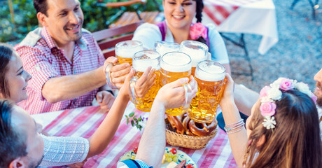 People enjoying food and drink in Bavarian beer garden