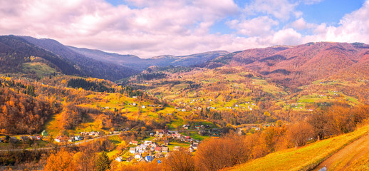 Carpatian village at mountains at the sunny day
