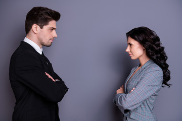 Profile side view portrait of his vs he her she attractive serious stylish content focused partners leadership meeting acquaintance deciding folded arms in formal wear isolated over gray background