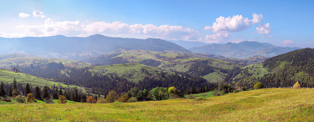 Carpatian village at mountains at the sunny day
