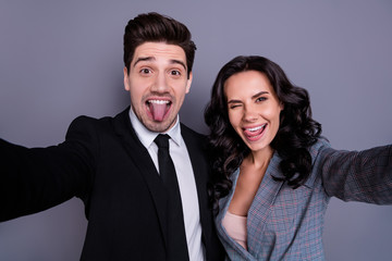 Self-portrait of his he her she nice attractive lovely stylish elegant cheerful cheery crazy foolish partners embracing blog blogger having fun time fooling isolated over gray pastel background