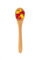  pills in wooden spoon