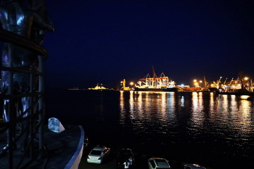 Sunset in the port of Odessa. Night views of piers and ships. Summer 2019.
