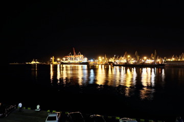 Sunset in the port of Odessa. Night views of piers and ships. Summer 2019.