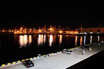 Sunset in the port of Odessa. Night views of piers and ships. Summer 2019.