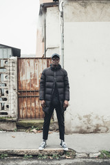 portrait of young african man standing in the street