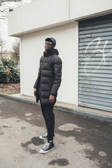 portrait of young african man standing in the street