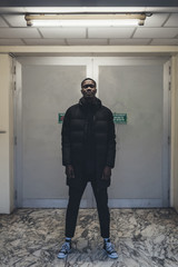 young african man posing looking camera