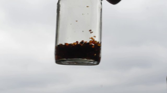 pieces of amber in a bottle on those cloudy skies