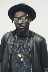 portrait of young african man standing alone and looking away