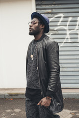 young bearded african man outdoors posing