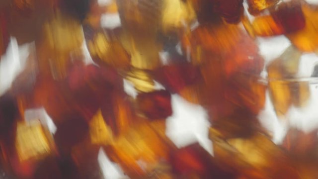 pieces of amber in a transparent bottle