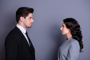 Profile side photo of minded people with wavy curly hairstyle brunet hairs standing face-to-face having disagreement wearing stylish blazer jacket tie isolated over grey background