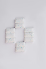 Chewing gums arranged on white background. Set of tasty chewing gums, top view.