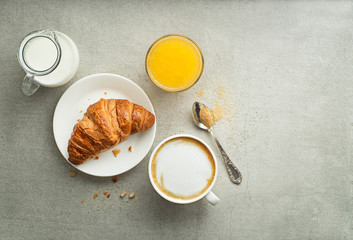 Breakfast with coffee and croissant