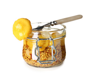Jar with canned squashes on white background