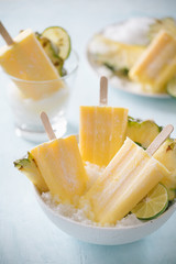 Homemade Pineapple Popsicles on a bowl(selective focus; close-up shot)