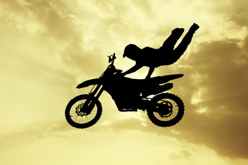 Fototapeta na wymiar illustration of freestyle motocross at sunset