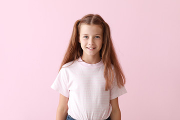 Cute little girl on color background