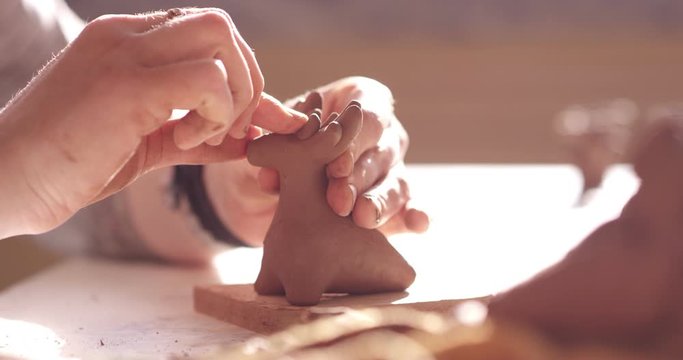 Sculpting of a clay toy