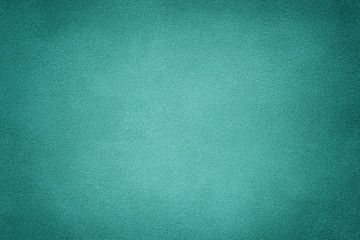 turquoise matt suede fabric closeup. Velvet texture.