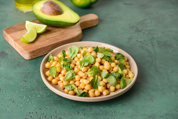 Plate with tasty tasty chickpea on table