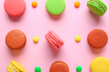 Sweet tasty macarons on color background
