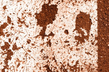 Old dirty asphalt surface with white paint on it brown color toned