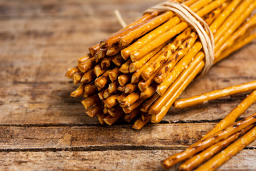 Pile of Salty bread sticks on a wooden table