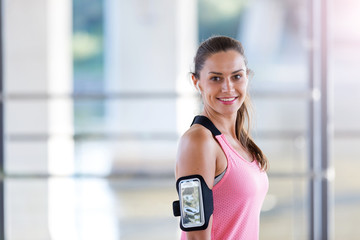 Female runner smiling during urban workout 