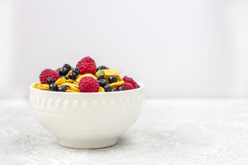 Healthy tasty breakfast: bowl with corn flakes.