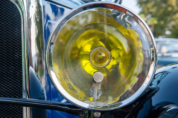 Close-up on headlight of antique car