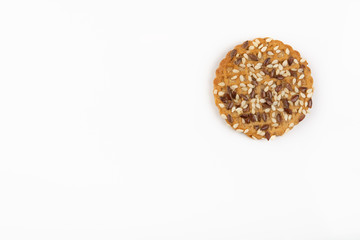 Concept of healthy nutrition: fitness cookies with sesame seeds isolated on white background.