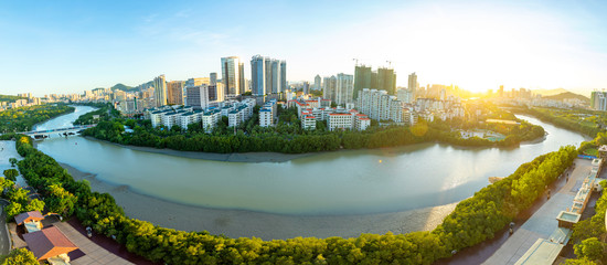 Aerial view of Sanya city with river at sunset light, Hainan province, China