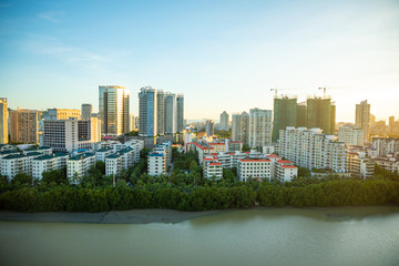 Aerial view of Sanya city with river at sunset light, Hainan province, China