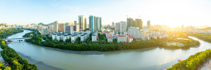 Aerial view of Sanya city with river at sunset light, Hainan province, China