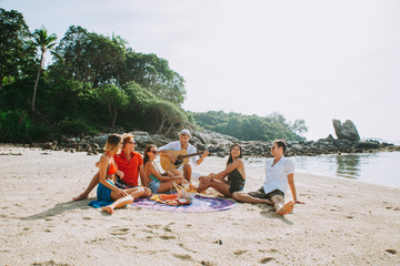 Group of friends celebrating on an island in Thailand