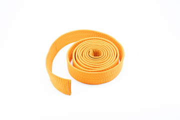 Orange karate belt on white background
