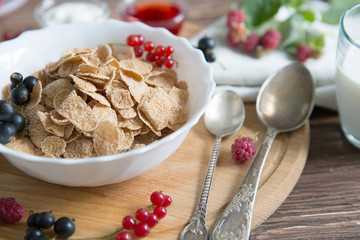 Cereal. Breakfast with muesli and berries. Top view, flat lay. Healthy tasty breakfast multigrain wholewheat healthy cereals with strawberries, raspberries, black currants and red currants.