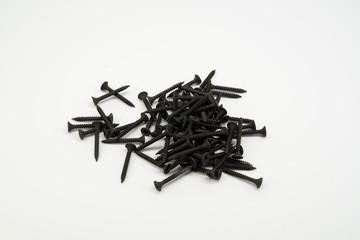 Screw black. Steel screw for a cross-head screwdriver. Wood carving