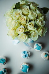 flowers on a white table with sweets