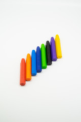 School supplies, colourful crayons stationery on white background - space for caption