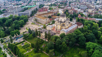 Fototapeta na wymiar Aerial view of Lviv old european city with red roofs. city hall tower. copy space