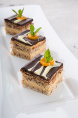 Three pieces of chocolate cakes decorated with mint