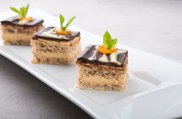 Three pieces of chocolate cakes decorated with mint