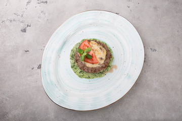 Prepared minced beef meat cutlet with spinach