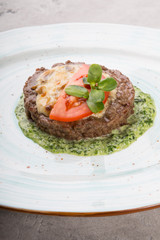 Prepared minced beef meat cutlet with spinach