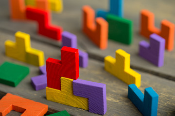 Creative solution for idea - business concept, jigsaw puzzle on the wooden desk