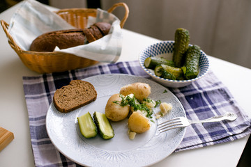 Sold cucumbers with potatoes in the plate