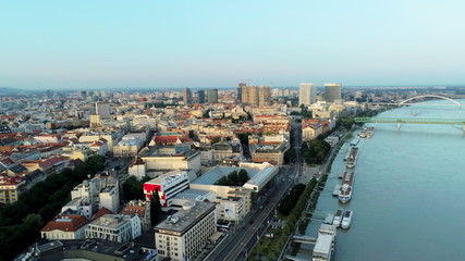 Fototapeta na wymiar Bratislava Aerial Cityline (Slovakia) over Danube River with Boats and Bridges at Sunset